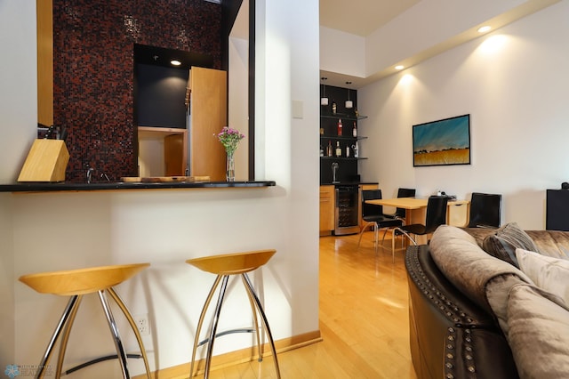 12 Broadway N Unit 206, Fargo, ND 58102 - indoor bar featuring wood finished floors, wine cooler, and recessed lighting