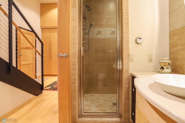 12 Broadway N Unit 206, Fargo, ND 58102 - full bath with a shower stall, wood finished floors, and vanity