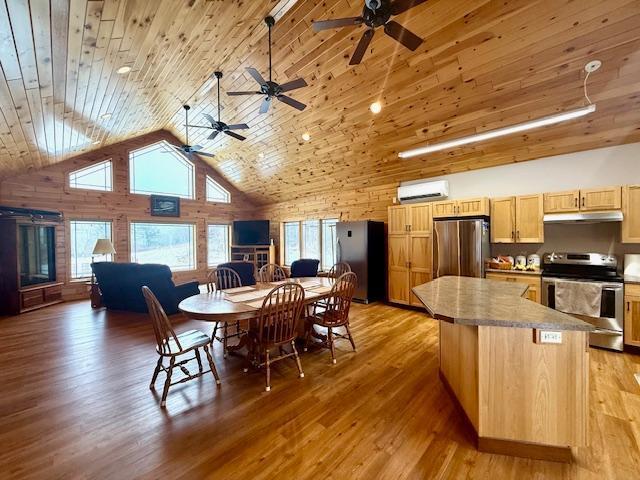 dining area featuring high vaulted ceiling, light hardwood / wood-style floors, and wooden ceiling