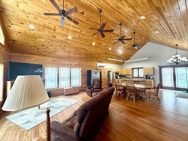 living room with high vaulted ceiling, a chandelier, wooden ceiling, and light hardwood / wood-style floors