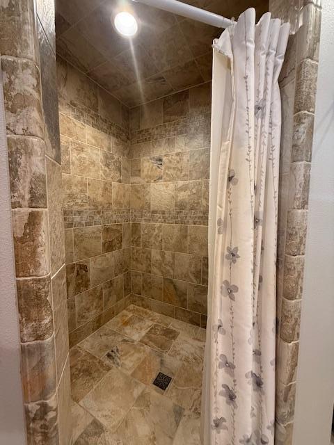 bathroom featuring walk in shower