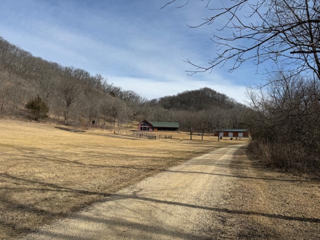 E2614 Bohland Hollow Rd, Wheatland Twp, WI 54624 - view of dirt / gravel driveway with a view of rural / pastoral area and a mountain view