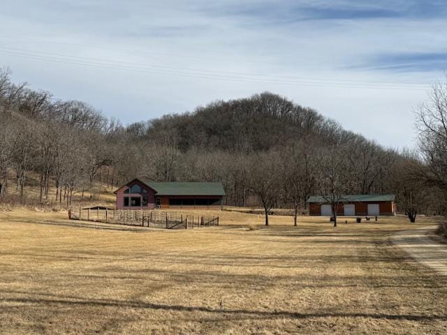 E2614 Bohland Hollow Rd, Wheatland Twp, WI 54624 - view of green lawn with a view of countryside and an outdoor structure
