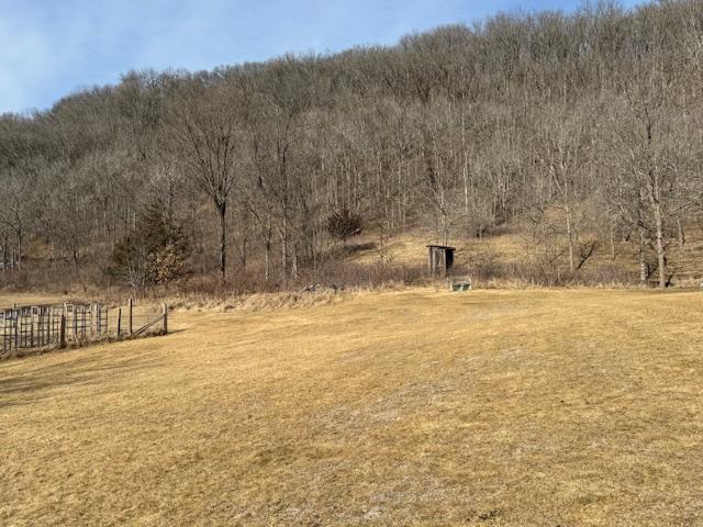 E2614 Bohland Hollow Rd, Wheatland Twp, WI 54624 - view of green lawn with a wooded view and a view of countryside