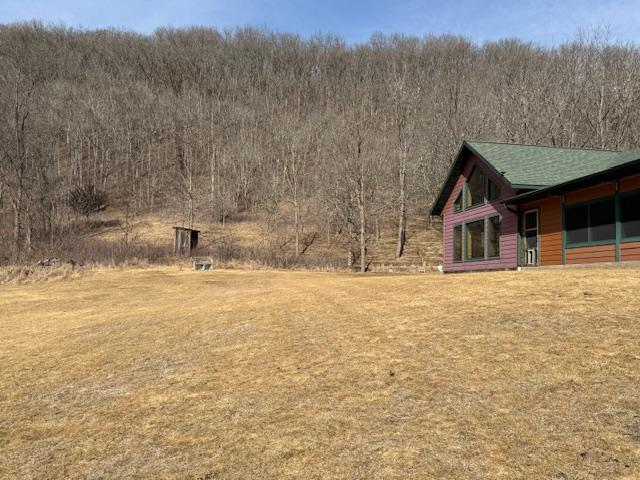 E2614 Bohland Hollow Rd, Wheatland Twp, WI 54624 - view of yard featuring a wooded view