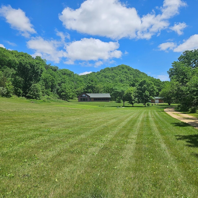 E2614 Bohland Hollow Rd, Wheatland Twp, WI 54624 - view of green lawn featuring a view of countryside and a forest view