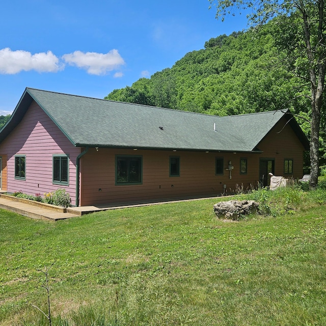 E2614 Bohland Hollow Rd, Wheatland Twp, WI 54624 - back of property featuring a yard and roof with shingles