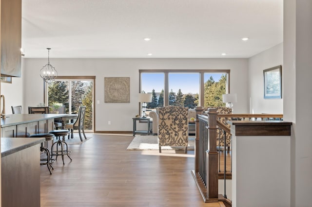 interior space featuring hardwood / wood-style flooring, a wealth of natural light, and a chandelier