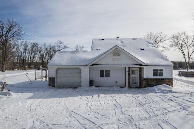 view of front of house with a garage and brick siding