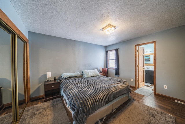 17813 Disse Rd, Erie Twp, MN 56501 - bedroom with wood finished floors, baseboards, a closet, and a textured ceiling