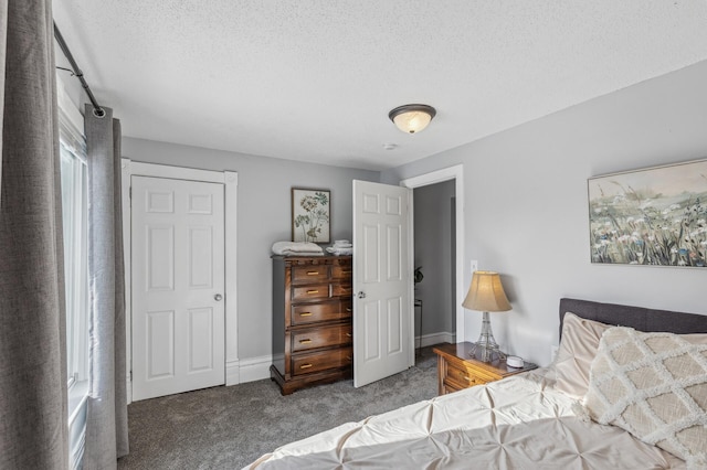 carpeted bedroom with a textured ceiling