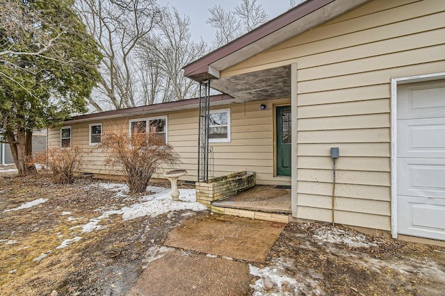 property entrance with a garage