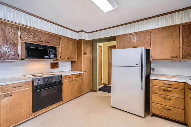 kitchen featuring brown cabinetry, light countertops, ornamental molding, and black appliances