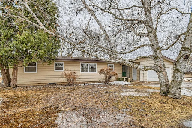 ranch-style house featuring an attached garage