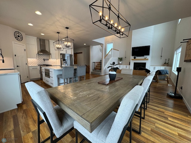 dining room featuring sink, dark hardwood / wood-style floors, and a healthy amount of sunlight