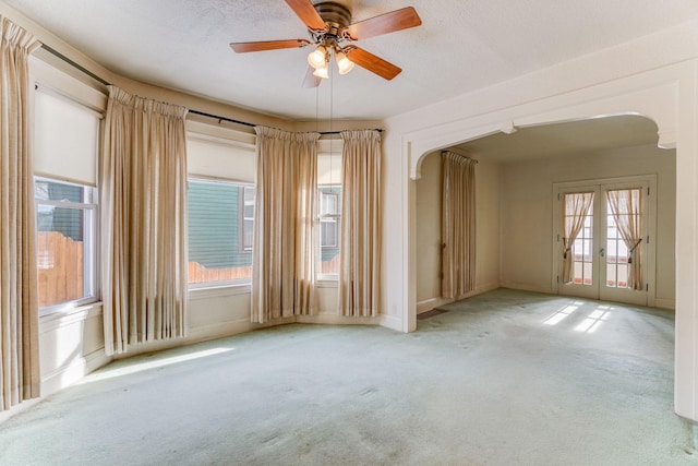 1802 3rd Ave N, Minneapolis, MN 55405 - empty room featuring french doors, ceiling fan, light carpet, and a textured ceiling