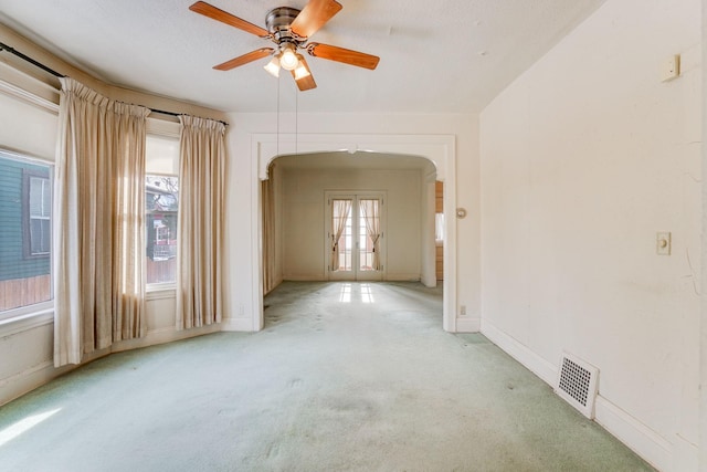 1802 3rd Ave N, Minneapolis, MN 55405 - empty room with french doors, light colored carpet, ceiling fan, and a textured ceiling