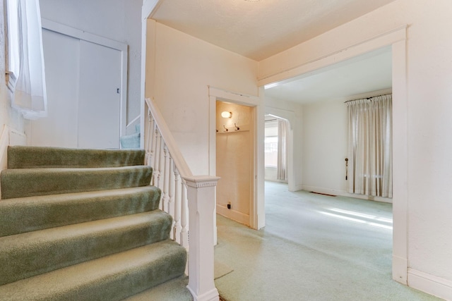 1802 3rd Ave N, Minneapolis, MN 55405 - staircase featuring carpet flooring