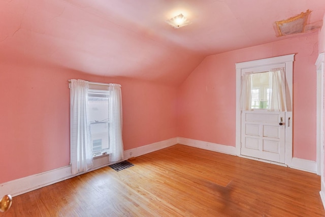 1802 3rd Ave N, Minneapolis, MN 55405 - additional living space featuring lofted ceiling and wood-type flooring