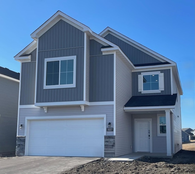 view of front of property featuring a garage