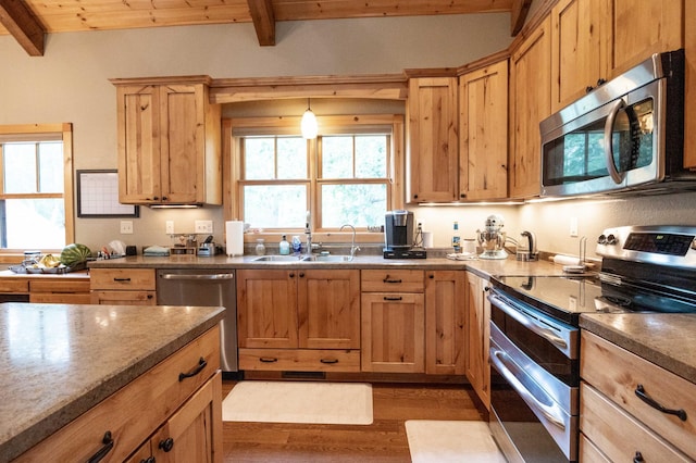 kitchen with appliances with stainless steel finishes, sink, wood ceiling, light hardwood / wood-style floors, and beam ceiling