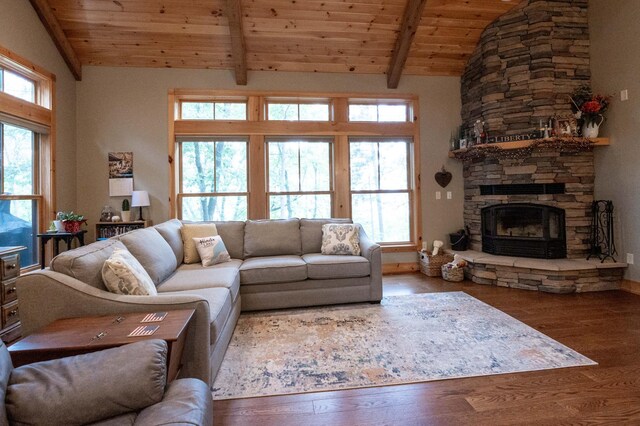 living room with beamed ceiling, wood-type flooring, wood ceiling, and a fireplace