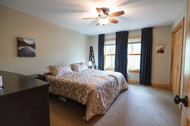 carpeted bedroom featuring ceiling fan