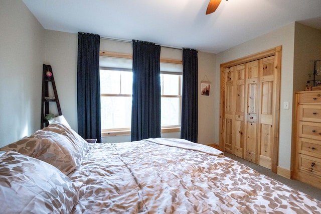 bedroom featuring ceiling fan, carpet flooring, and a closet