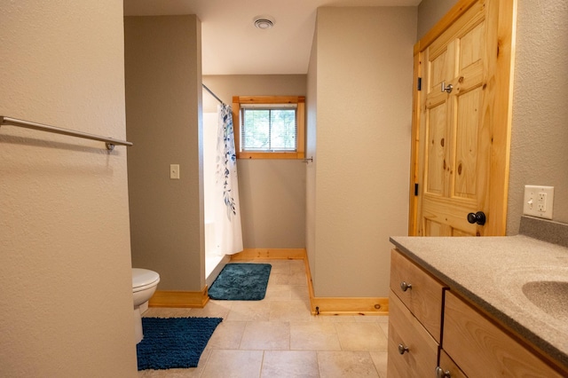 bathroom with vanity, a shower with curtain, and toilet