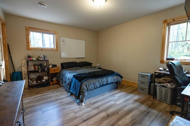 bedroom with light hardwood / wood-style floors