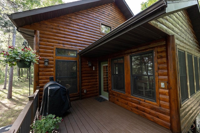 wooden terrace featuring area for grilling