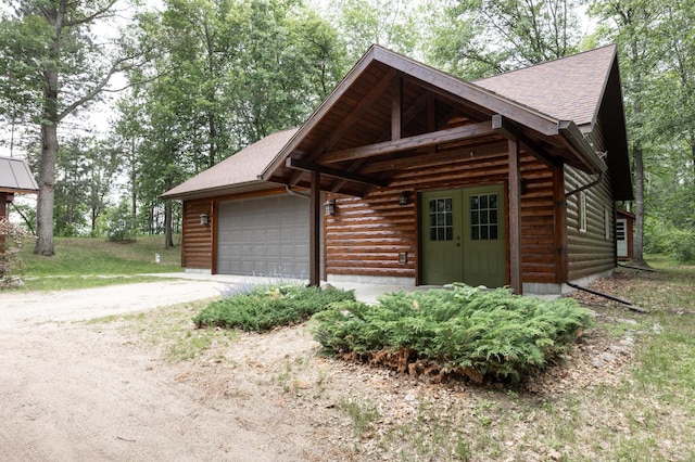 cabin featuring a garage