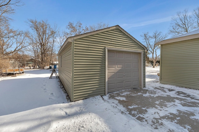 view of snow covered garage