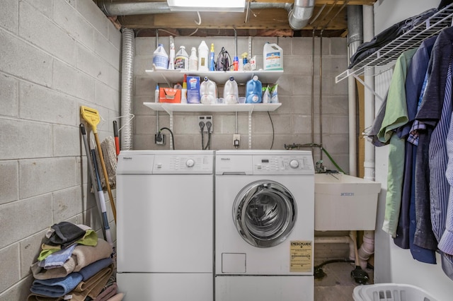 laundry room with sink and washer and clothes dryer