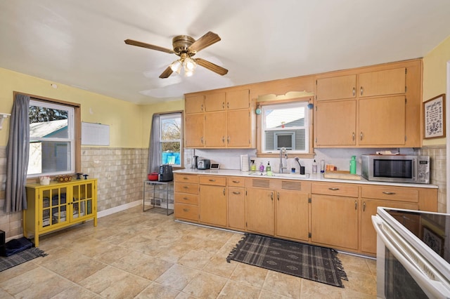 kitchen with sink, white electric range, plenty of natural light, and ceiling fan