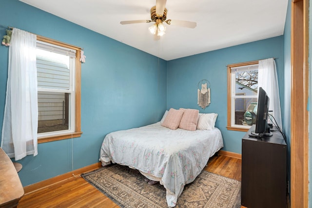 bedroom with ceiling fan and hardwood / wood-style floors