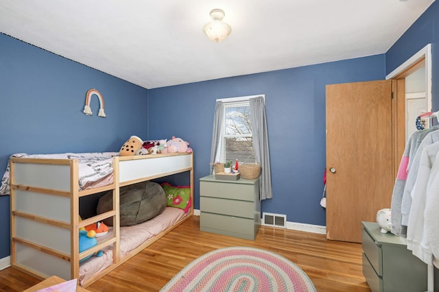 bedroom featuring hardwood / wood-style flooring