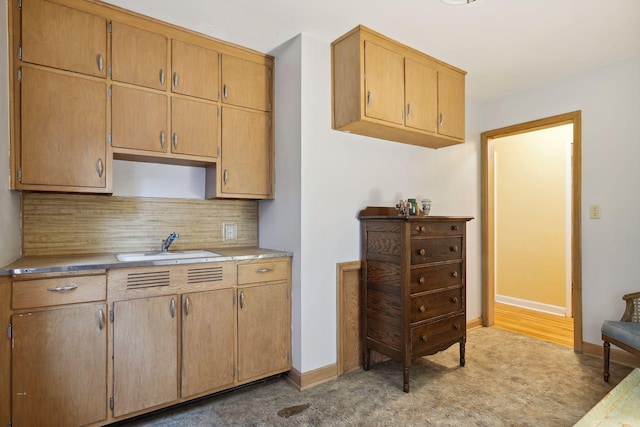 kitchen with sink and decorative backsplash