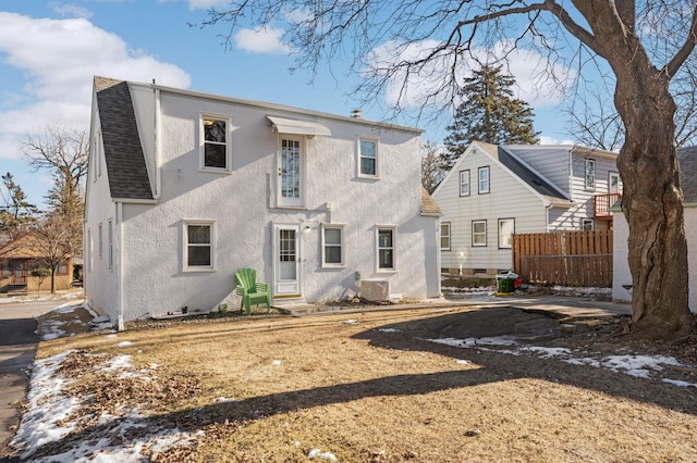 rear view of property with ac unit