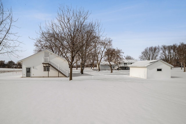 snowy yard with stairs