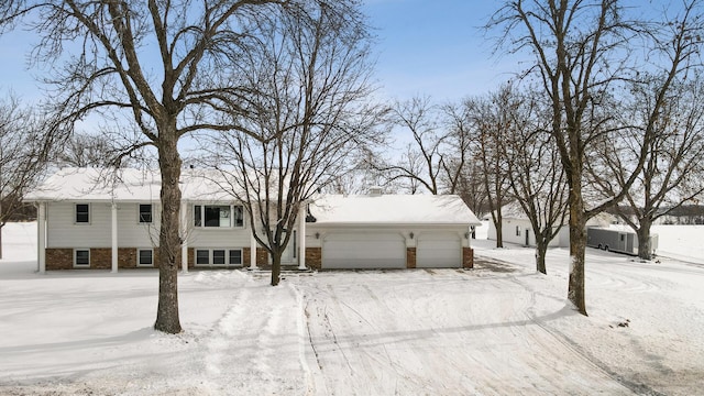 view of front of property with brick siding and an attached garage