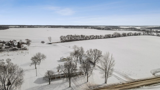 snowy aerial view featuring a rural view