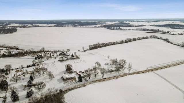 snowy aerial view featuring a rural view