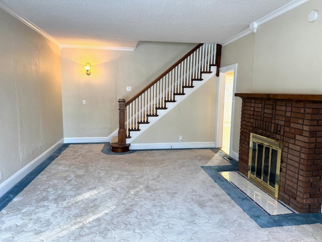 unfurnished living room with carpet floors, crown molding, a fireplace, and a textured ceiling