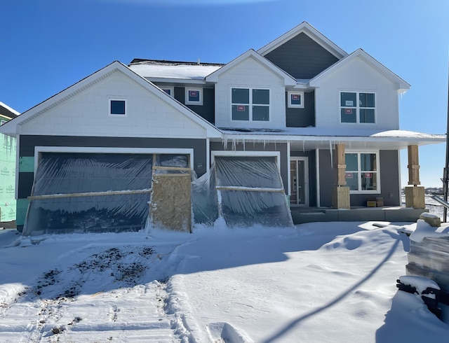 view of front of home featuring a garage and covered porch