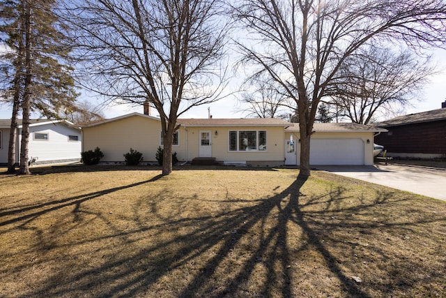 ranch-style home with a garage and a front lawn