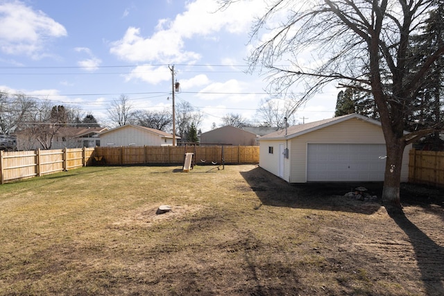 view of yard with a garage and an outdoor structure