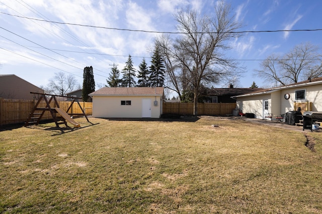 view of yard featuring an outdoor structure and a playground