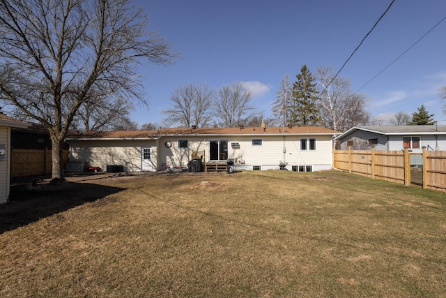 rear view of house with a yard