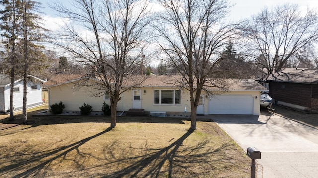 view of front of property featuring a garage and a front yard